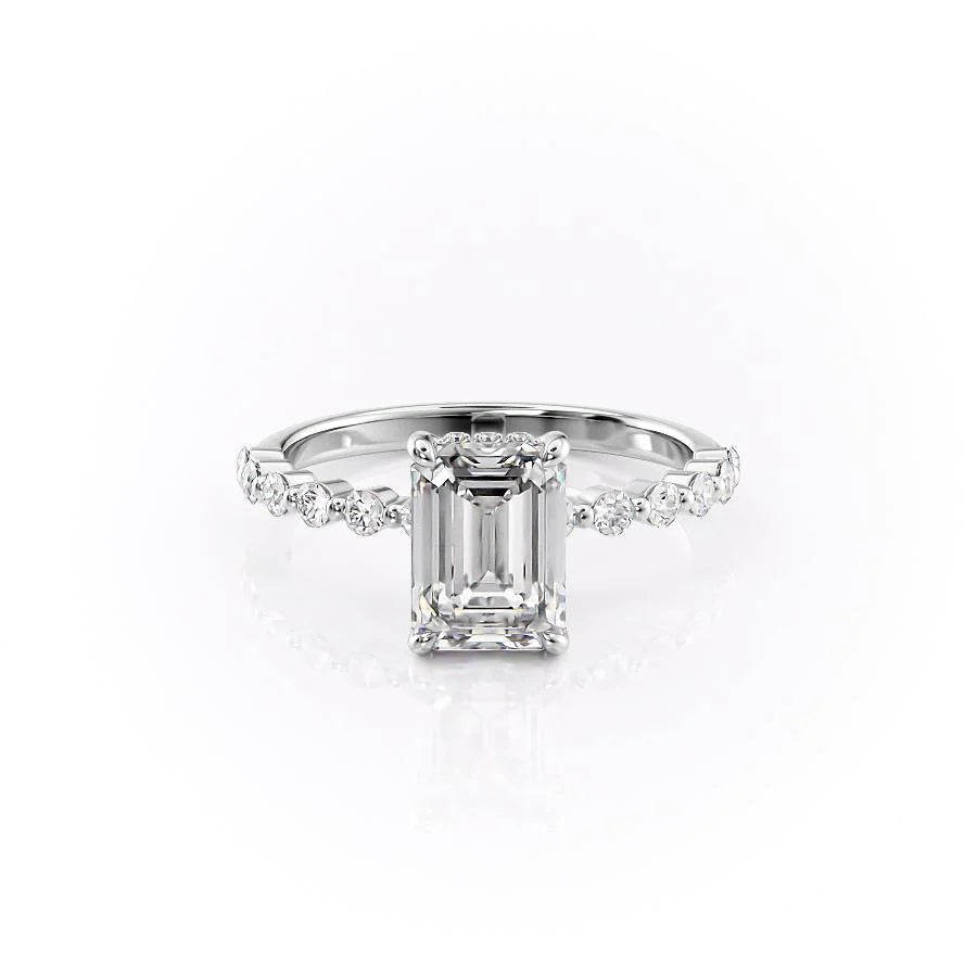The Khloe. A White Gold Side Stones, Hidden Halo Engagement Ring Set With A 2ct Emerald Lab Grown Diamond. White Background.