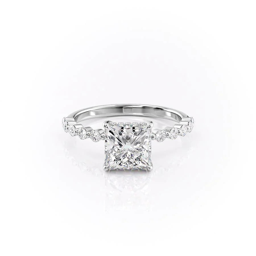 The Khloe. A White Gold Side Stones, Hidden Halo Engagement Ring Set With A 2ct Princess Lab Grown Diamond. White Background.