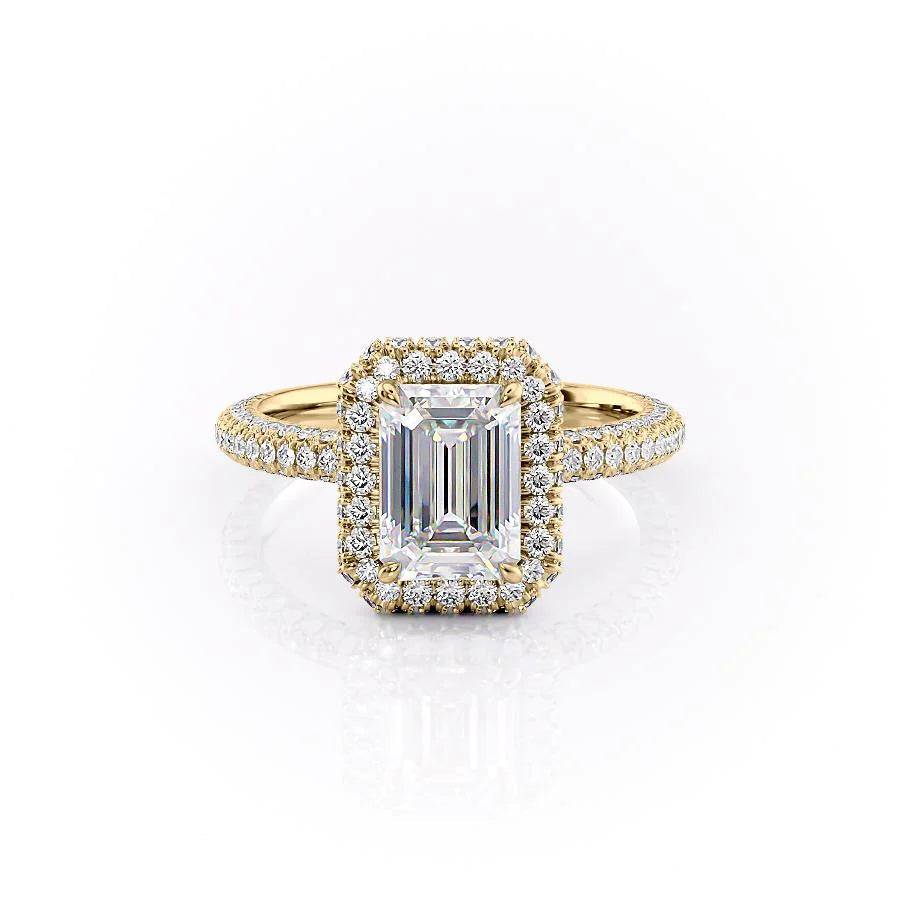 The Kylie. A Yellow Gold Halo, Pave Engagement Ring Set With A 2ct Emerald Lab Grown Diamond. White Background.