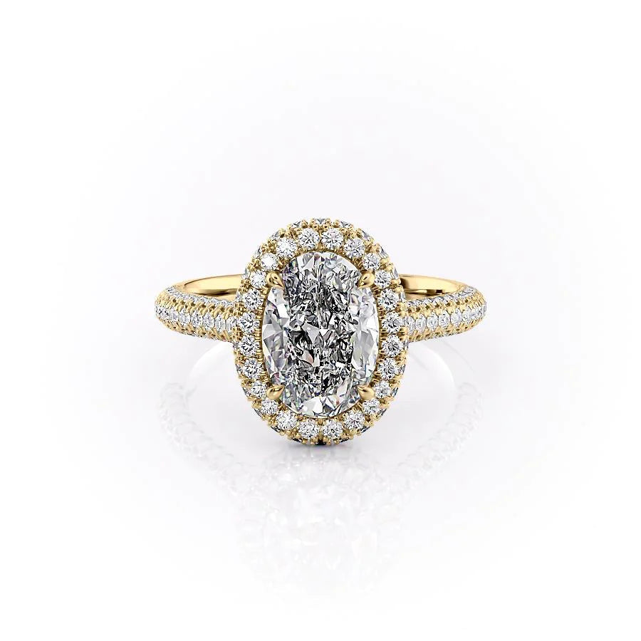 The Kylie. A Yellow Gold Halo, Pave Engagement Ring Set With A 2ct Oval Lab Grown Diamond. White Background.
