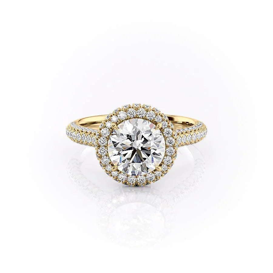 The Kylie. A Yellow Gold Halo, Pave Engagement Ring Set With A 2ct Round Lab Grown Diamond. White Background.