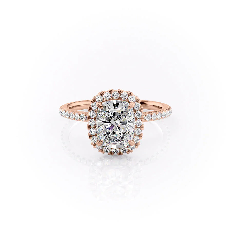 The Lenny. A Rose Gold Halo, Pave Engagement Ring Set With A 2ct Elongated Cushion Lab Grown Diamond. White Background.