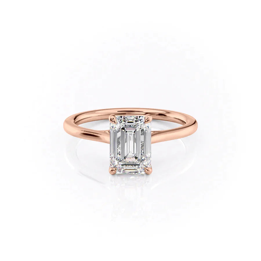 The Lexie. A Rose Gold Solitaire Engagement Ring Set With A 2ct Emerald Lab Grown Diamond. White Background.
