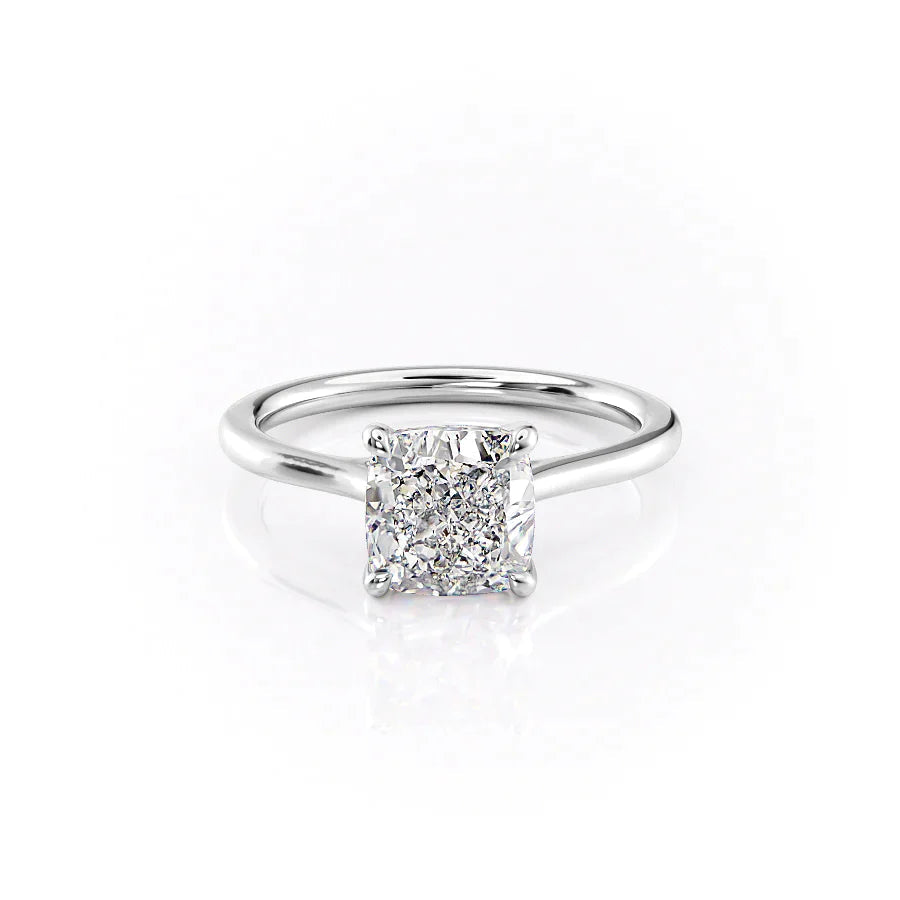 The Lexie. A White Gold Solitaire Engagement Ring Set With A 2ct Cushion Lab Grown Diamond. White Background.