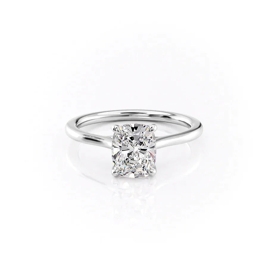 The Lexie. A White Gold Solitaire Engagement Ring Set With A 2ct Elongated Cushion Lab Grown Diamond. White Background.