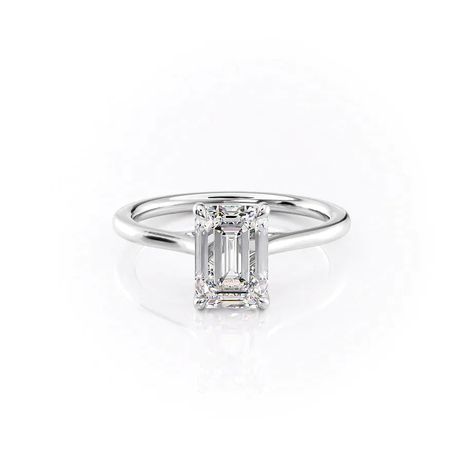 The Lexie. A White Gold Solitaire Engagement Ring Set With A 2ct Emerald Lab Grown Diamond. White Background.
