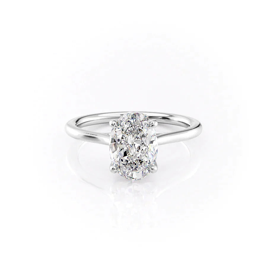 The Lexie. A White Gold Solitaire Engagement Ring Set With A 2ct Oval Lab Grown Diamond. White Background.