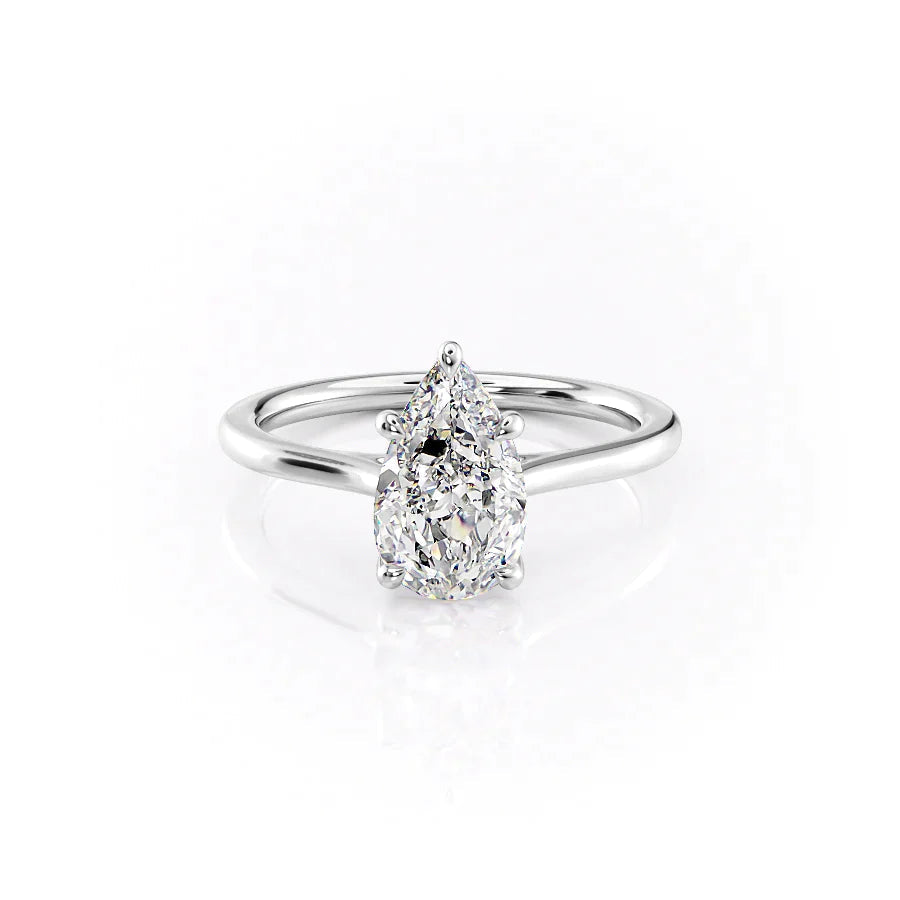 The Lexie. A White Gold Solitaire Engagement Ring Set With A 2ct Pear Lab Grown Diamond. White Background.