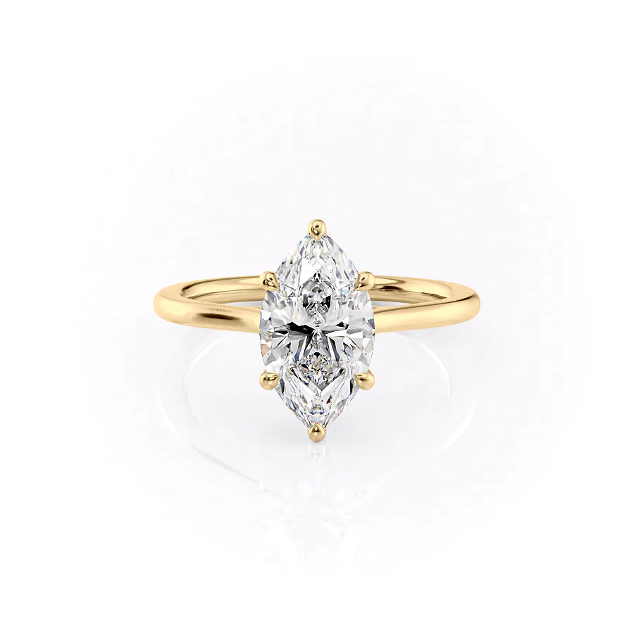 The Lexie. A Yellow Gold Solitaire Engagement Ring Set With A 2ct Marquise Lab Grown Diamond. White Background.