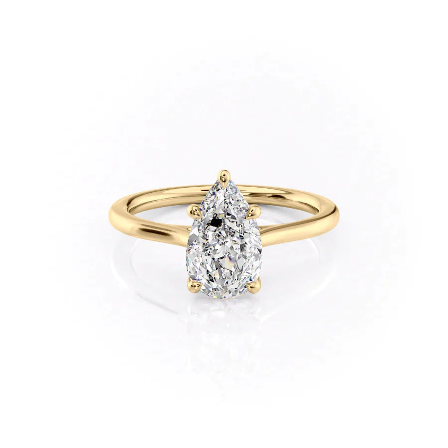 The Lexie. A Yellow Gold Solitaire Engagement Ring Set With A 2ct Pear Lab Grown Diamond. White Background.