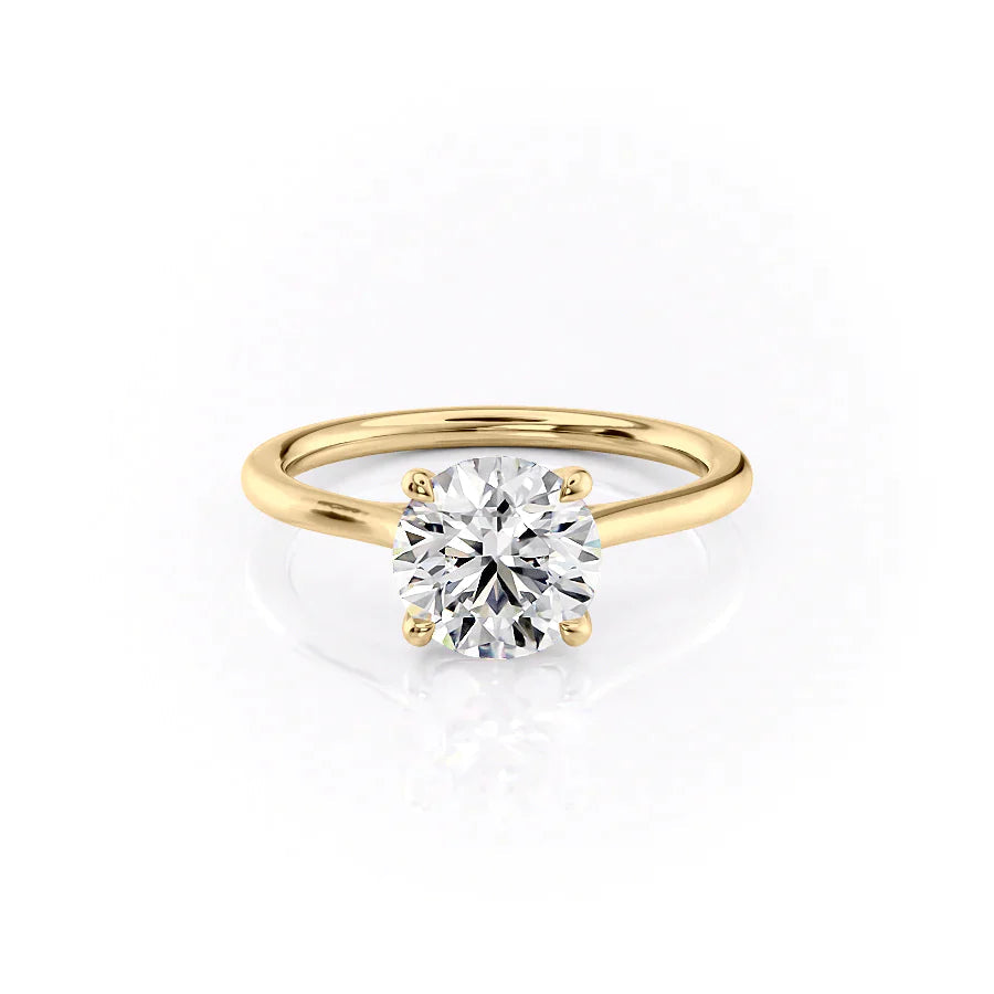 The Lexie. A Yellow Gold Solitaire Engagement Ring Set With A 2ct Round Lab Grown Diamond. White Background.