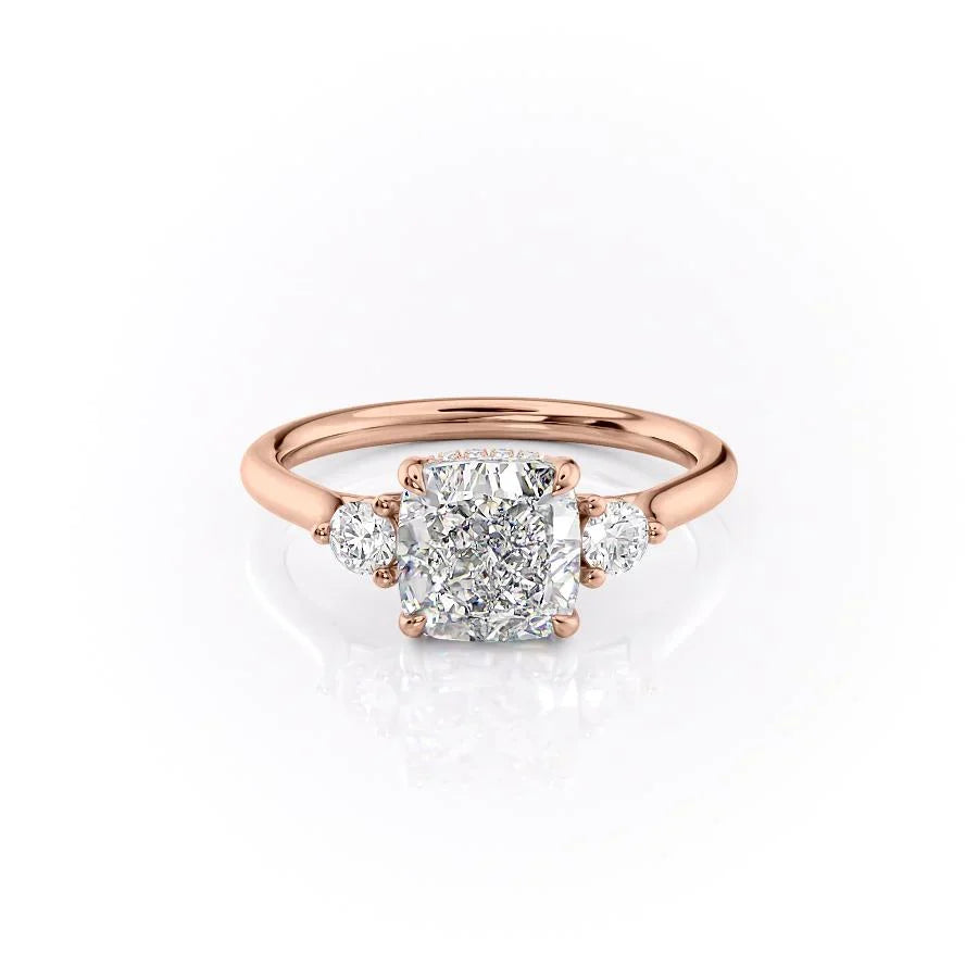 The Lia. A Rose Gold Three Stone Engagement Ring Set With A 2ct Cushion Lab Grown Diamond. White Background.