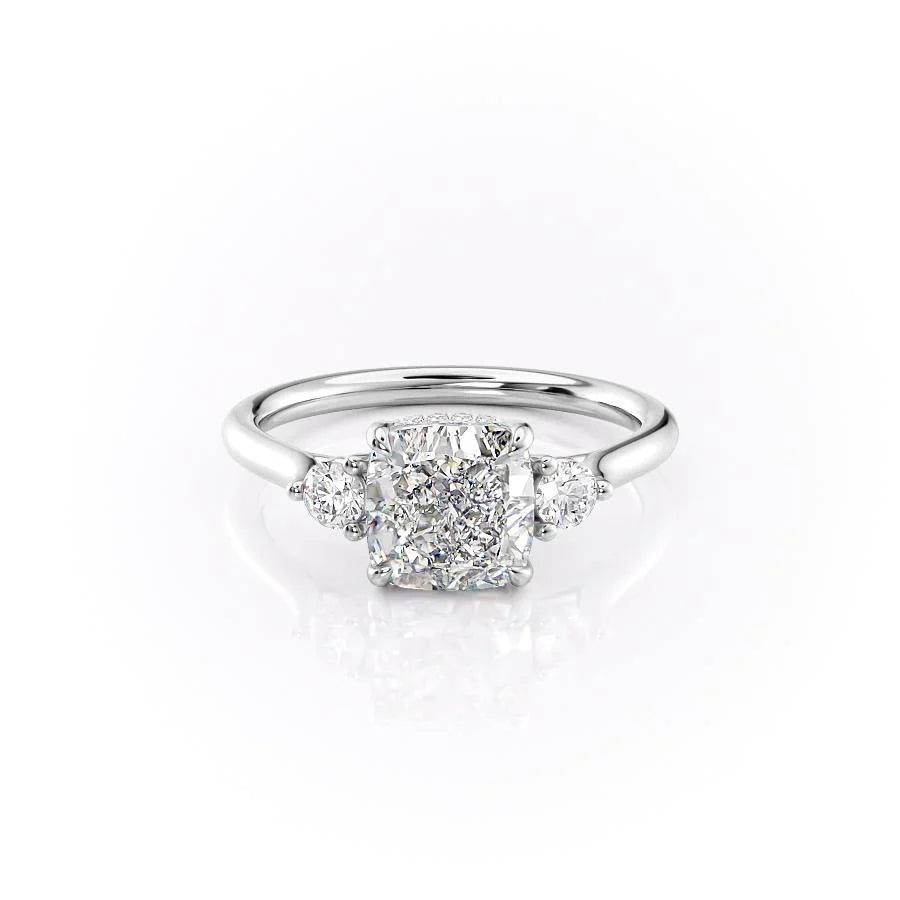 The Lia. A White Gold Three Stone Engagement Ring Set With A 2ct Cushion Lab Grown Diamond. White Background.