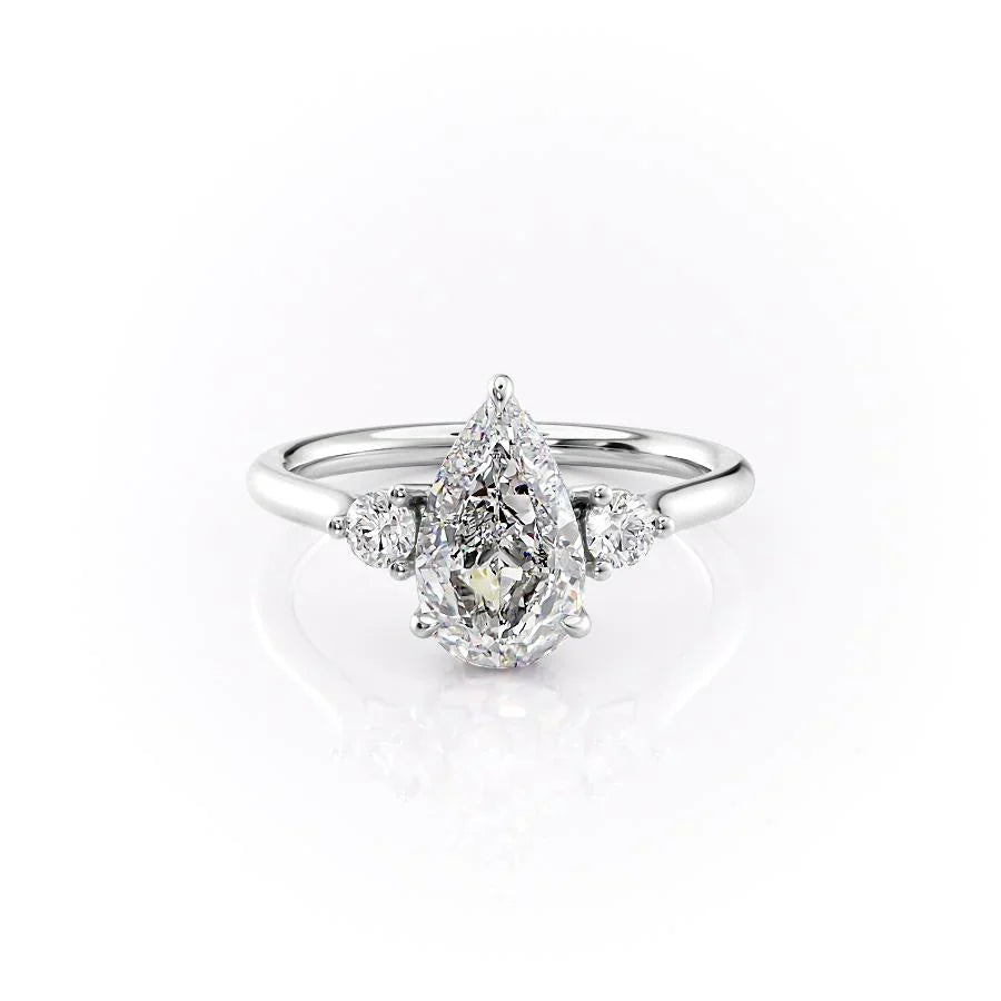 The Lia. A White Gold Three Stone Engagement Ring Set With A 2ct Pear Lab Grown Diamond. White Background.