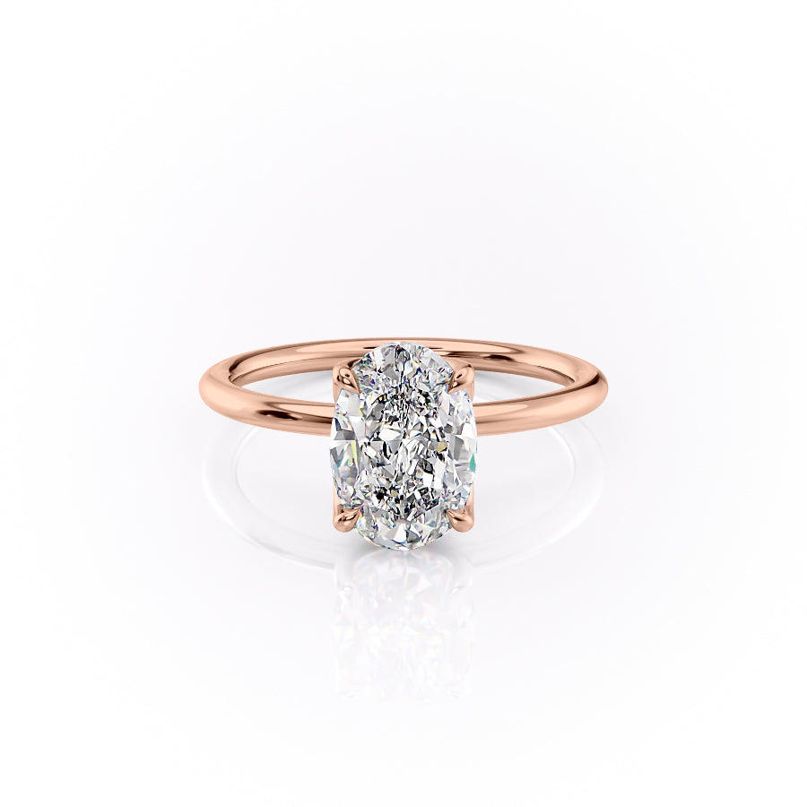 The Lisa. A Rose Gold Solitaire, Nature Engagement Ring Set With A 2ct Oval Lab Grown Diamond. White Background.