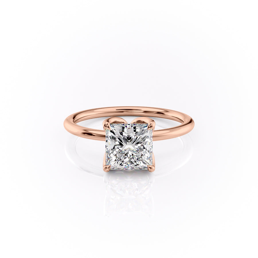 The Lisa. A Rose Gold Solitaire, Nature Engagement Ring Set With A 2ct Princess Lab Grown Diamond. White Background.