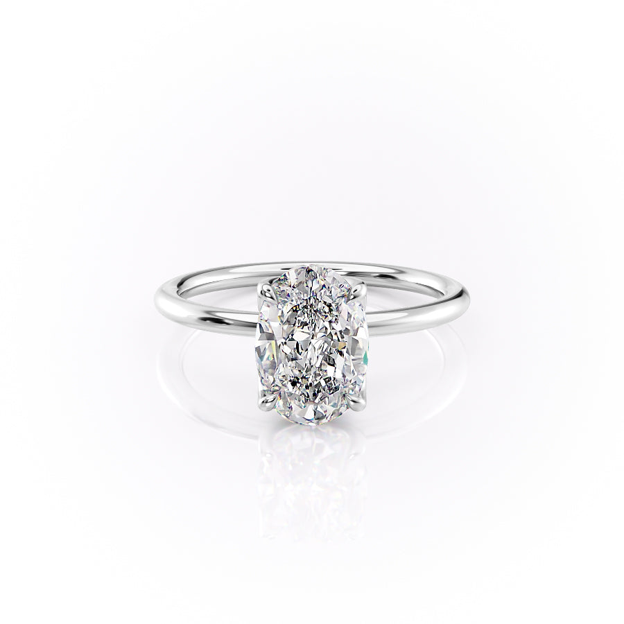 The Lisa. A White Gold Solitaire, Nature Engagement Ring Set With A 2ct Oval Lab Grown Diamond. White Background.