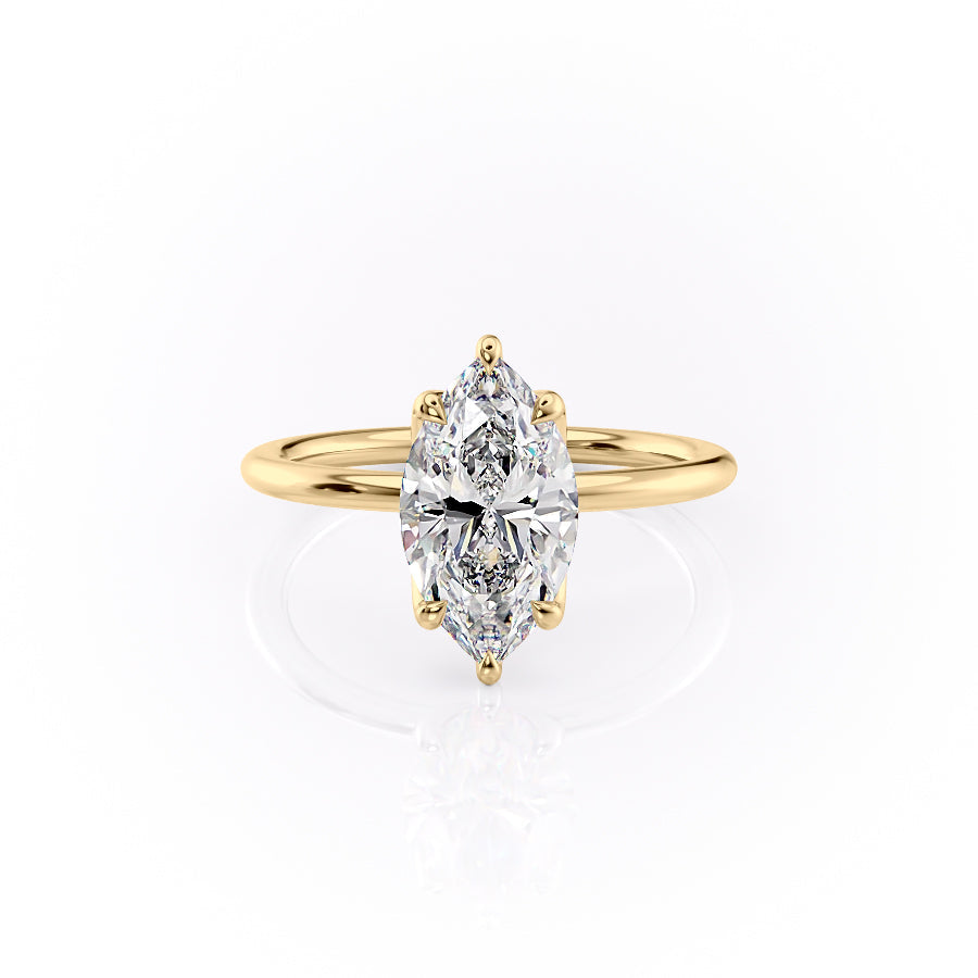 The Lisa. A Yellow Gold Solitaire, Nature Engagement Ring Set With A 2ct Marquise Lab Grown Diamond. White Background.
