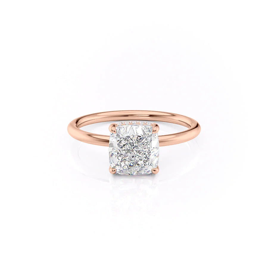 The Low Profile Kamellie. A Rose Gold Solitaire, Hidden Halo Engagement Ring Set With A 2ct Cushion Lab Grown Diamond. White Background.
