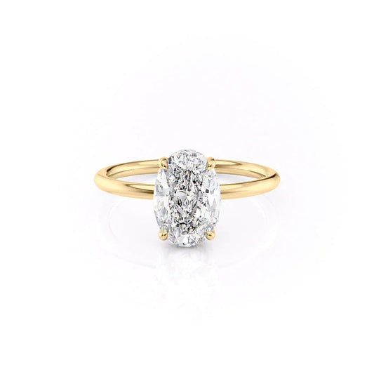 The Low Profile Kamellie. A Yellow Gold Solitaire, Hidden Halo Engagement Ring Set With A 2ct Oval Lab Grown Diamond. White Background.