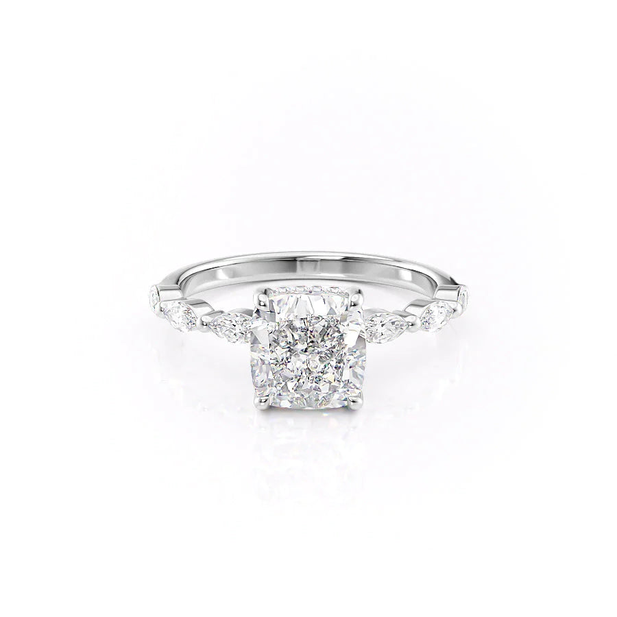 The Lucia. A White Gold Side Stones, Hidden Halo Engagement Ring Set With A 2ct Cushion Lab Grown Diamond. White Background.