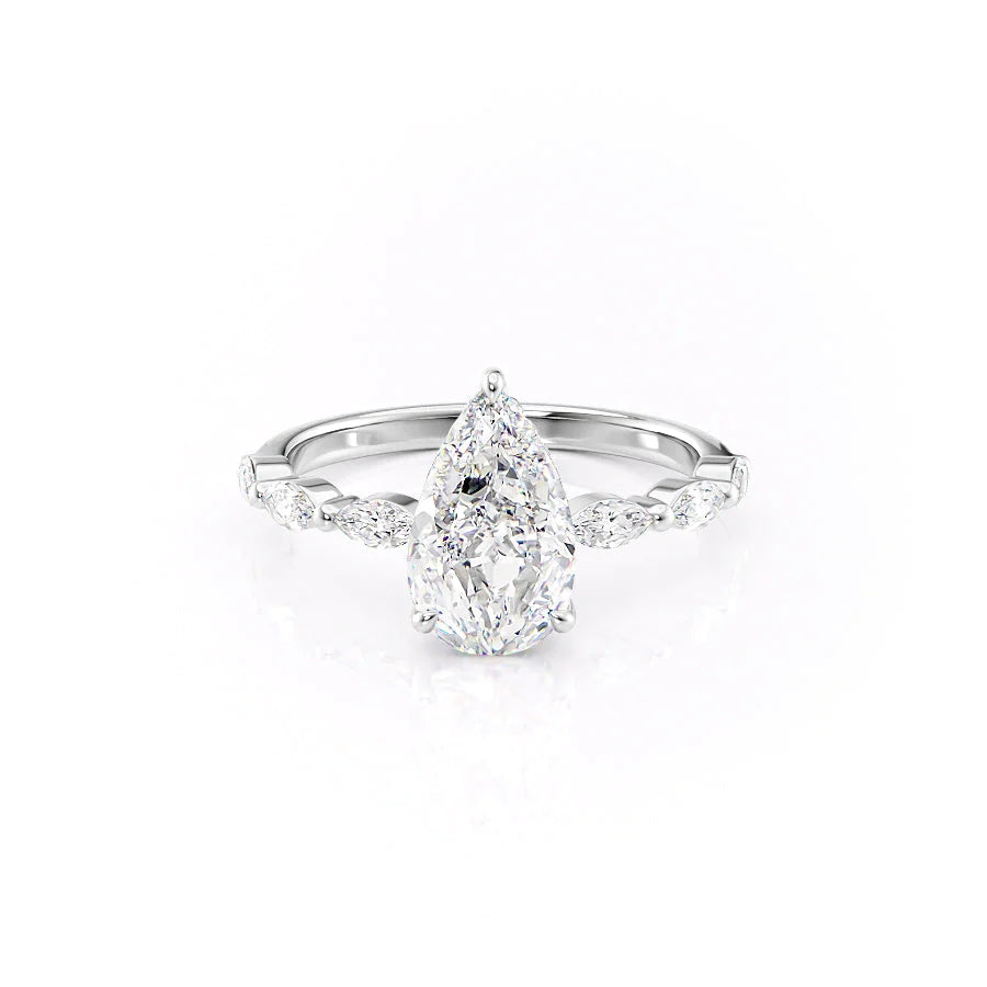The Lucia. A White Gold Side Stones, Hidden Halo Engagement Ring Set With A 2ct Pear Lab Grown Diamond. White Background.