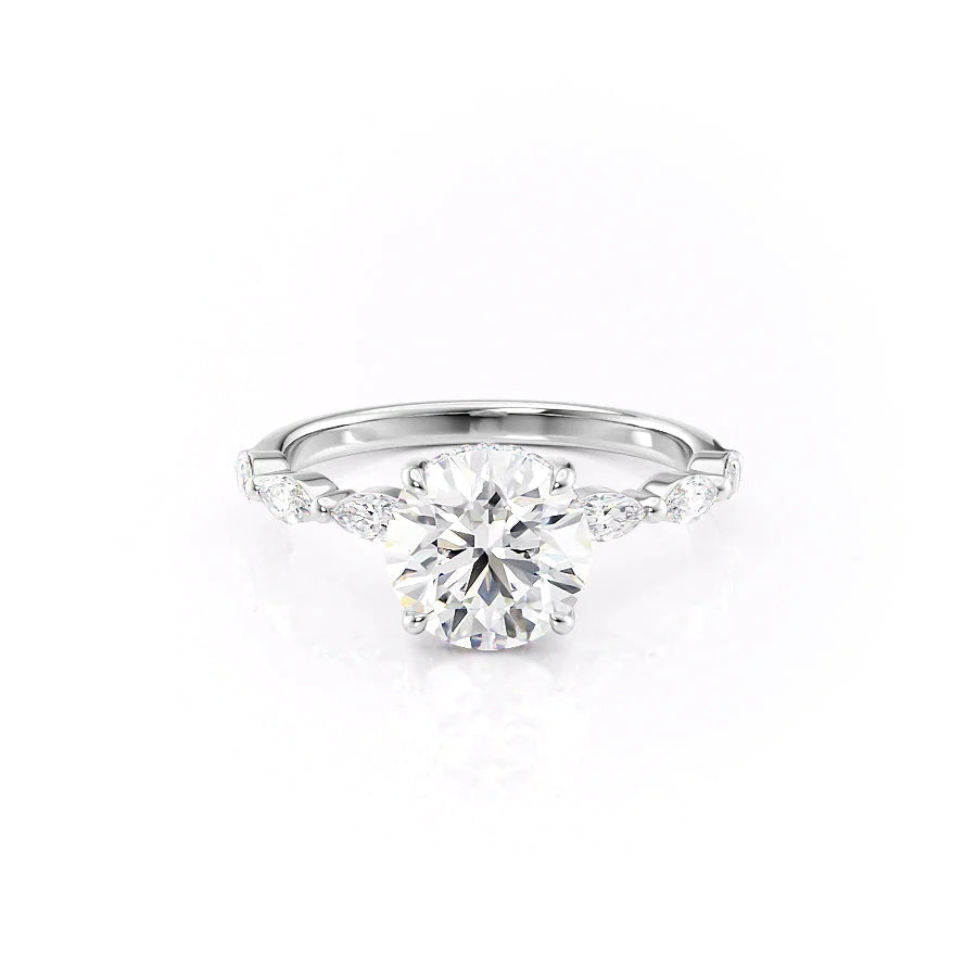 The Lucia. A White Gold Side Stones, Hidden Halo Engagement Ring Set With A 2ct Round Lab Grown Diamond. White Background.
