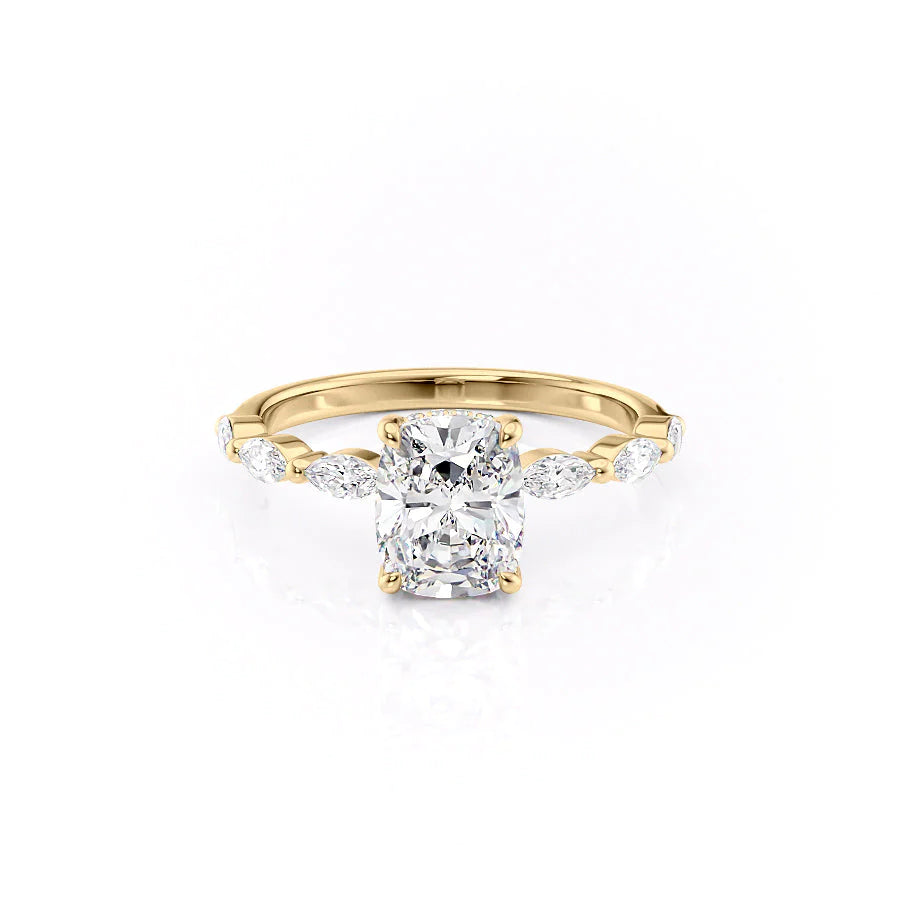 The Lucia. A Yellow Gold Side Stones, Hidden Halo Engagement Ring Set With A 2ct Elongated Cushion Lab Grown Diamond. White Background.