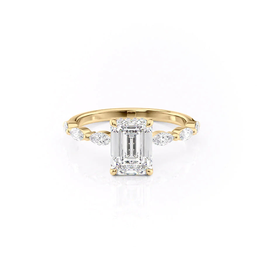 The Lucia. A Yellow Gold Side Stones, Hidden Halo Engagement Ring Set With A 2ct Emerald Lab Grown Diamond. White Background.