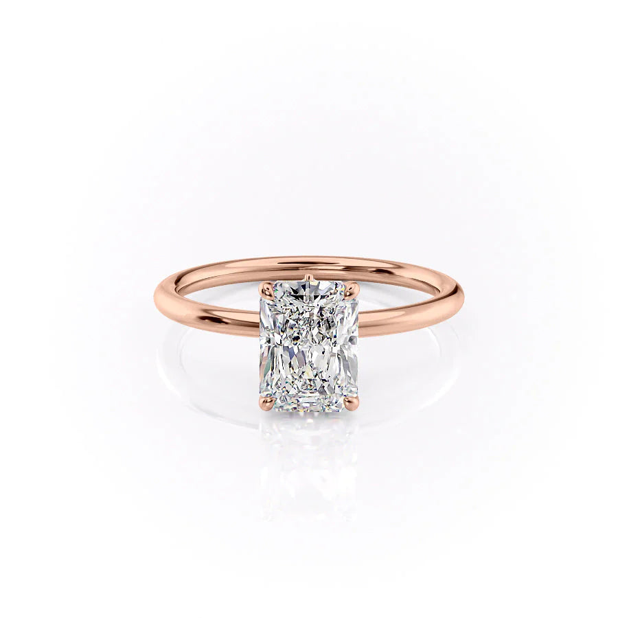 The Luna. A Rose Gold Solitaire, Nature Engagement Ring Set With A 2ct Radiant Lab Grown Diamond. White Background.