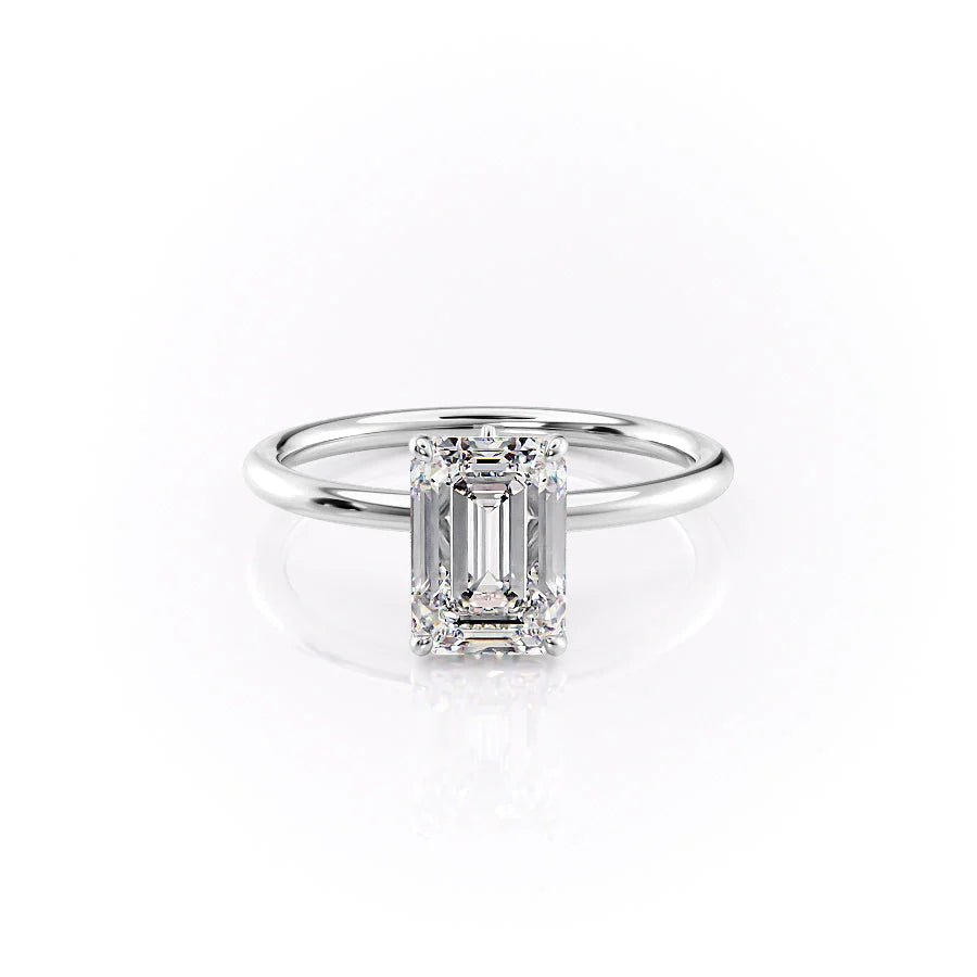 The Luna. A White Gold Solitaire, Nature Engagement Ring Set With A 2ct Emerald Lab Grown Diamond. White Background.