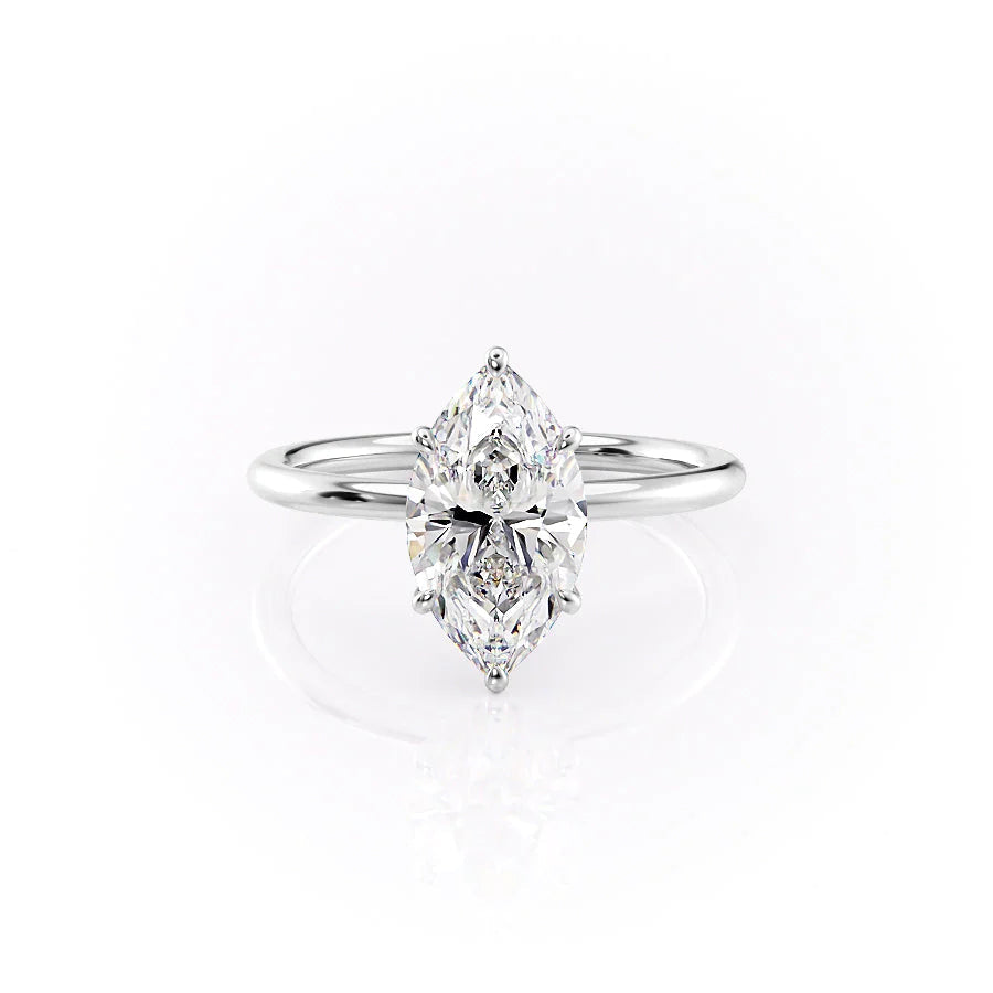 The Luna. A White Gold Solitaire, Nature Engagement Ring Set With A 2ct Marquise Lab Grown Diamond. White Background.