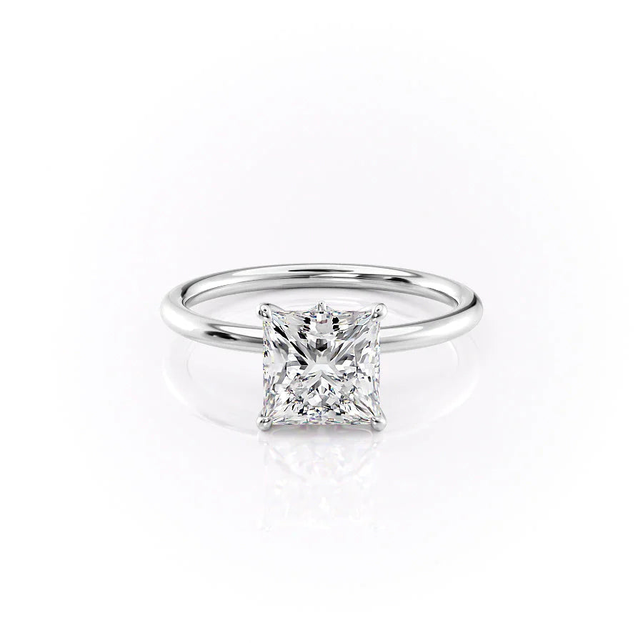 The Luna. A White Gold Solitaire, Nature Engagement Ring Set With A 2ct Princess Lab Grown Diamond. White Background.