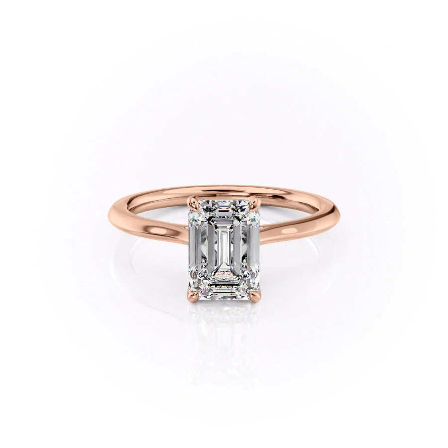 The Madison. A Rose Gold Solitaire, Nature Engagement Ring Set With A 2ct Emerald Lab Grown Diamond. White Background.