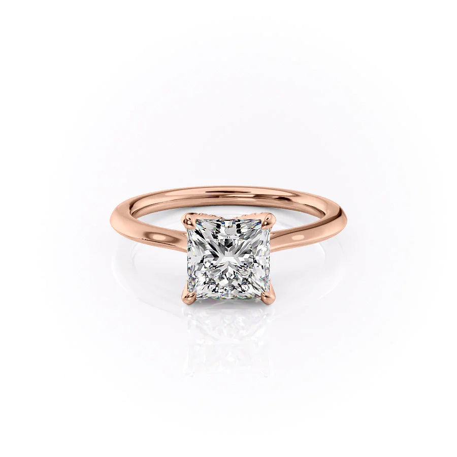 The Madison. A Rose Gold Solitaire, Nature Engagement Ring Set With A 2ct Princess Lab Grown Diamond. White Background.