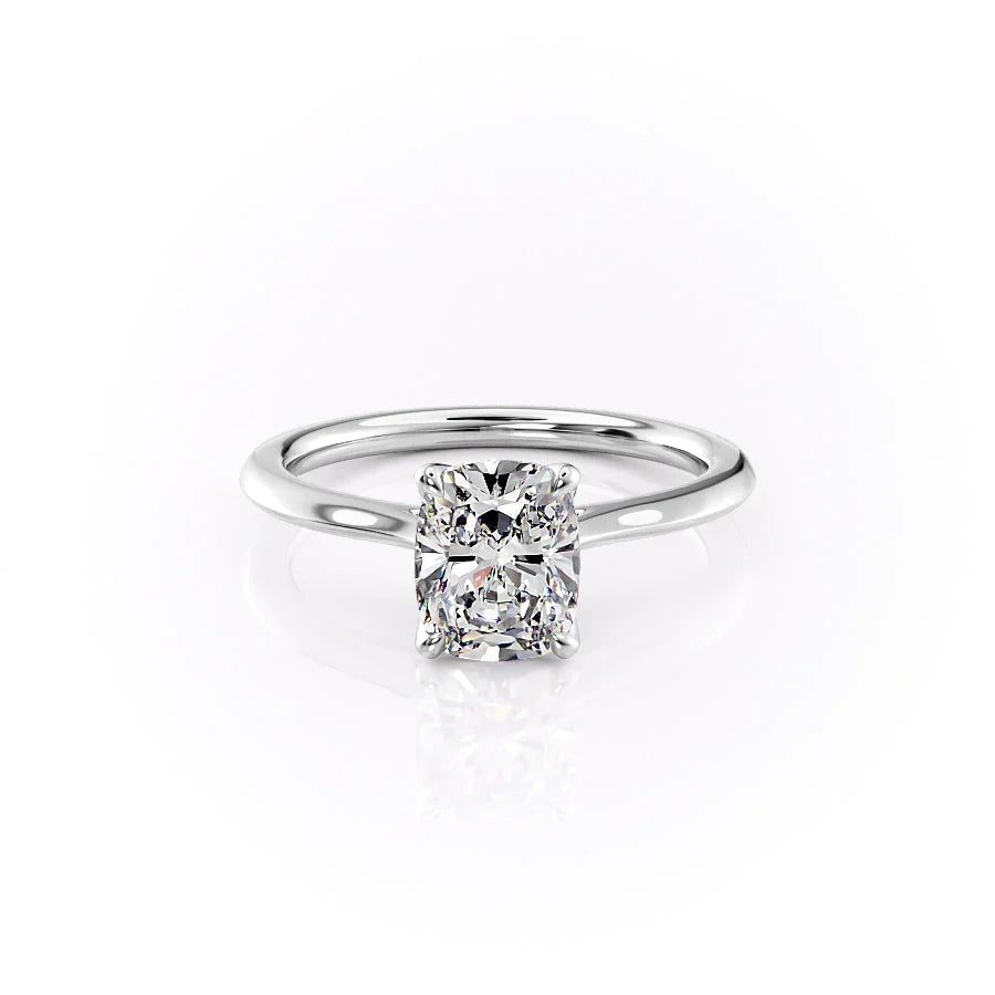 The Madison. A White Gold Solitaire, Nature Engagement Ring Set With A 2ct Elongated Cushion Lab Grown Diamond. White Background.
