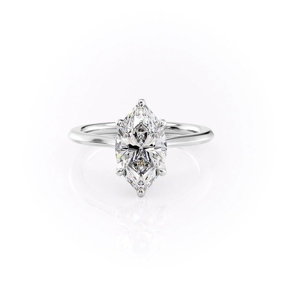 The Madison. A White Gold Solitaire, Nature Engagement Ring Set With A 2ct Marquise Lab Grown Diamond. White Background.