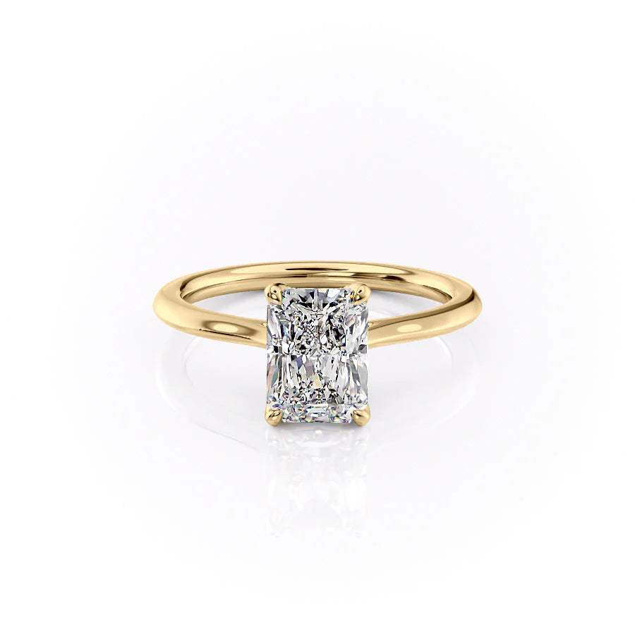 The Madison. A Yellow Gold Solitaire, Nature Engagement Ring Set With A 2ct Radiant Lab Grown Diamond. White Background.