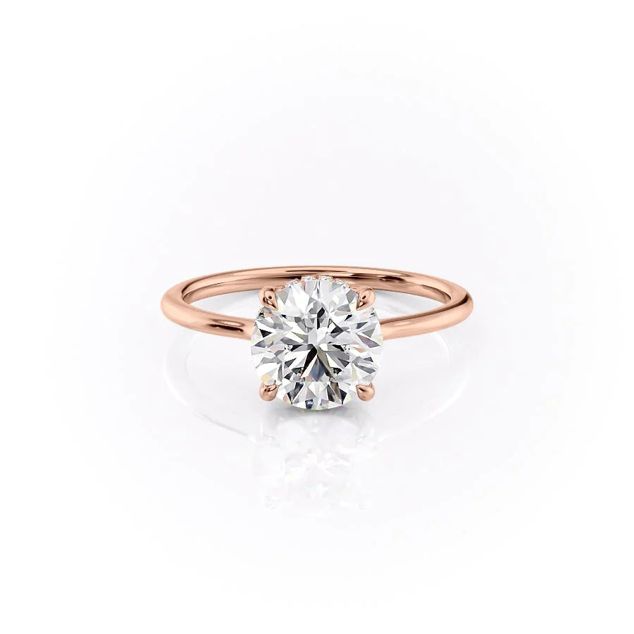 The Maia. A Rose Gold Solitaire, Hidden Halo Engagement Ring Set With A 2ct Round Lab Grown Diamond. White Background.