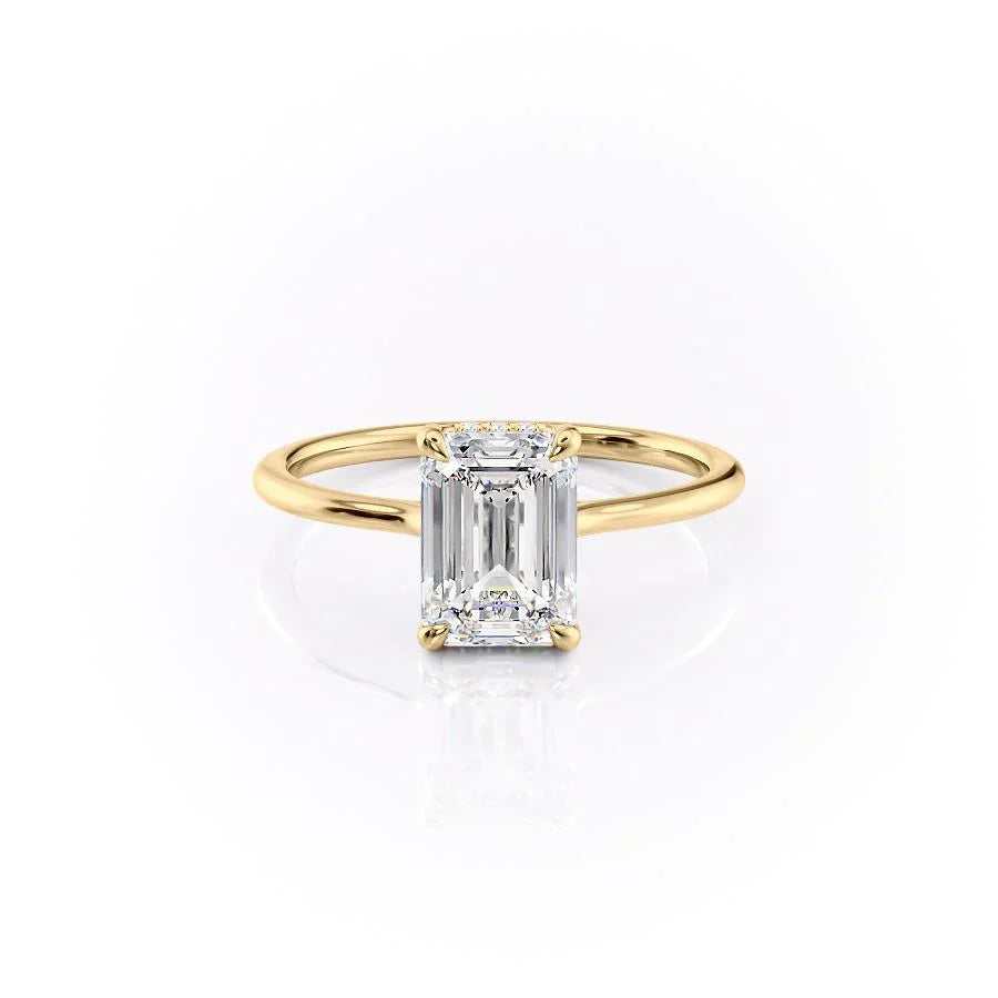 The Maia. A Yellow Gold Solitaire, Hidden Halo Engagement Ring Set With A 2ct Emerald Lab Grown Diamond. White Background.