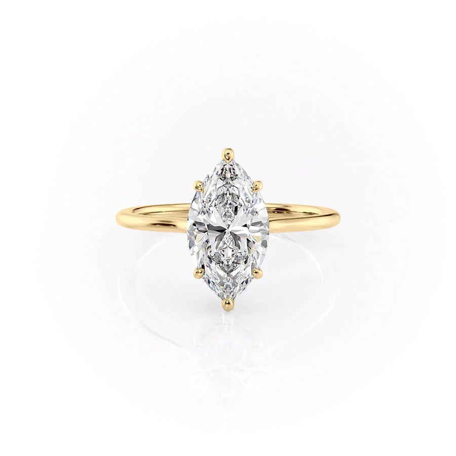 The Maia. A Yellow Gold Solitaire, Hidden Halo Engagement Ring Set With A 2ct Marquise Lab Grown Diamond. White Background.