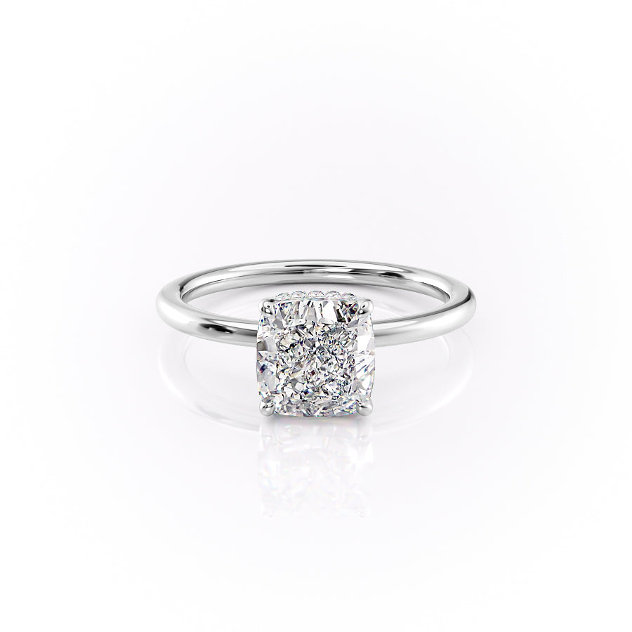 The Margot. A White Gold Solitaire, Hidden Halo Engagement Ring Set With A 2ct Cushion Lab Grown Diamond. White Background.
