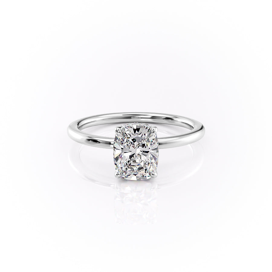 The Margot. A White Gold Solitaire, Hidden Halo Engagement Ring Set With A 2ct Elongated Cushion Lab Grown Diamond. White Background.