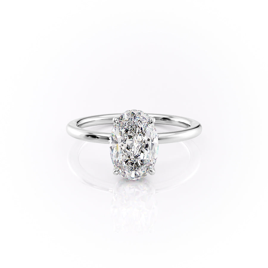 The Margot. A White Gold Solitaire, Hidden Halo Engagement Ring Set With A 2ct Oval Lab Grown Diamond. White Background.