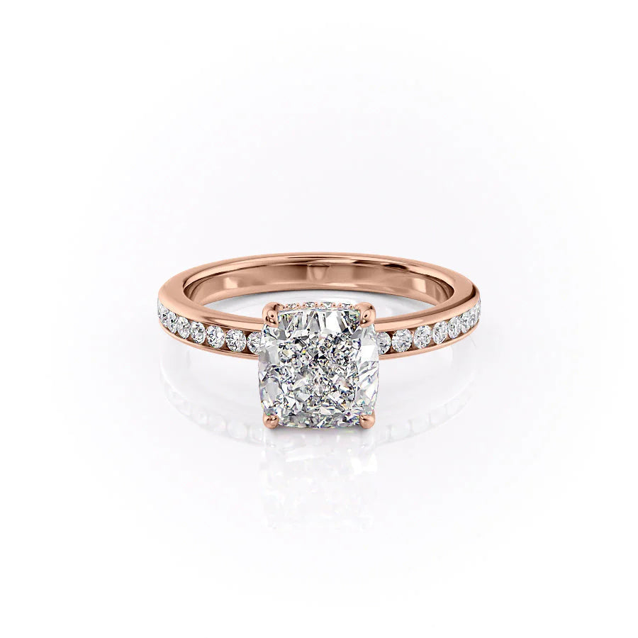 The Marilyn. A Rose Gold Channel-Set, Side Stones, Hidden Halo Engagement Ring Set With A 2ct Cushion Lab Grown Diamond. White Background.