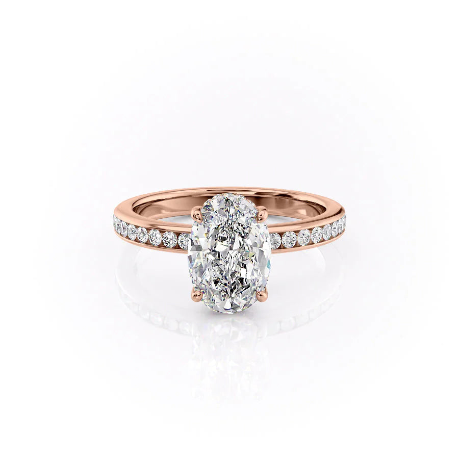 The Marilyn. A Rose Gold Channel-Set, Side Stones, Hidden Halo Engagement Ring Set With A 2ct Oval Lab Grown Diamond. White Background.