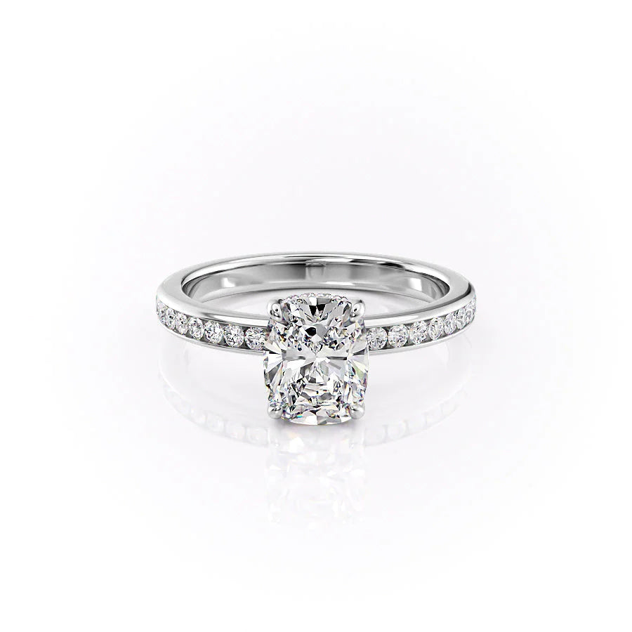 The Marilyn. A White Gold Channel-Set, Side Stones, Hidden Halo Engagement Ring Set With A 2ct Elongated Cushion Lab Grown Diamond. White Background.