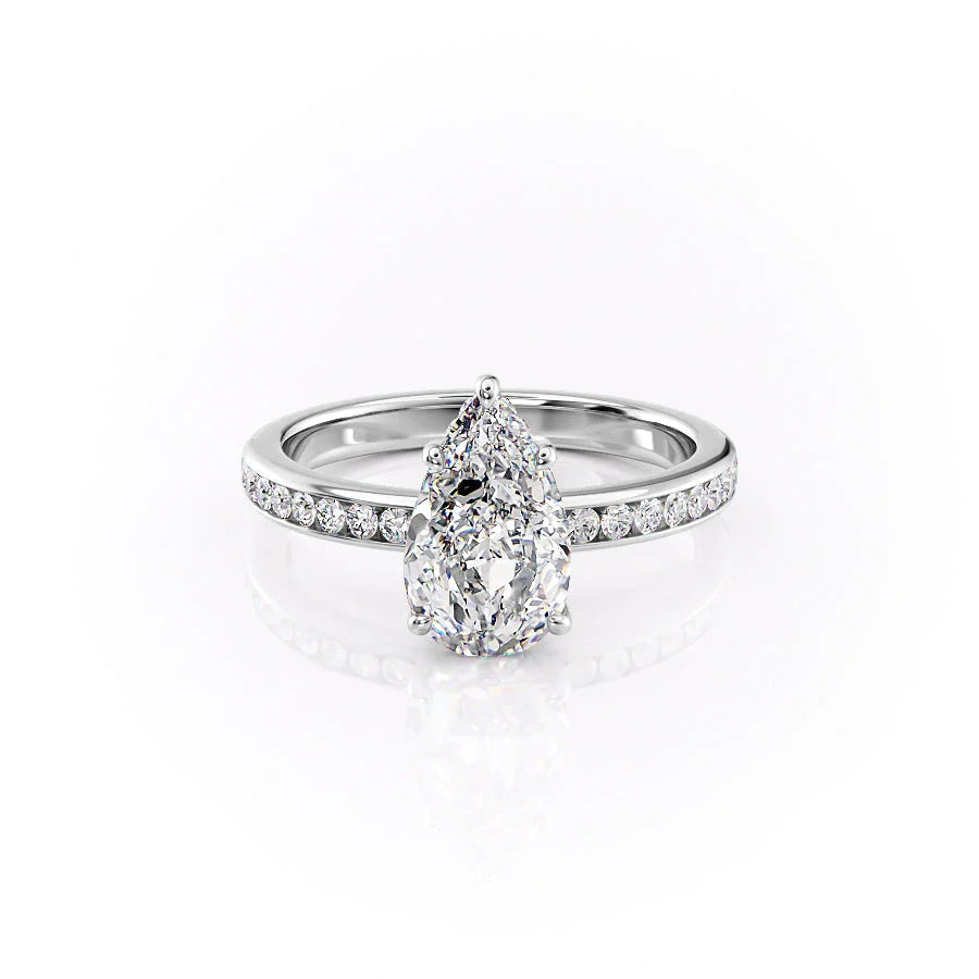 The Marilyn. A White Gold Channel-Set, Side Stones, Hidden Halo Engagement Ring Set With A 2ct Pear Lab Grown Diamond. White Background.