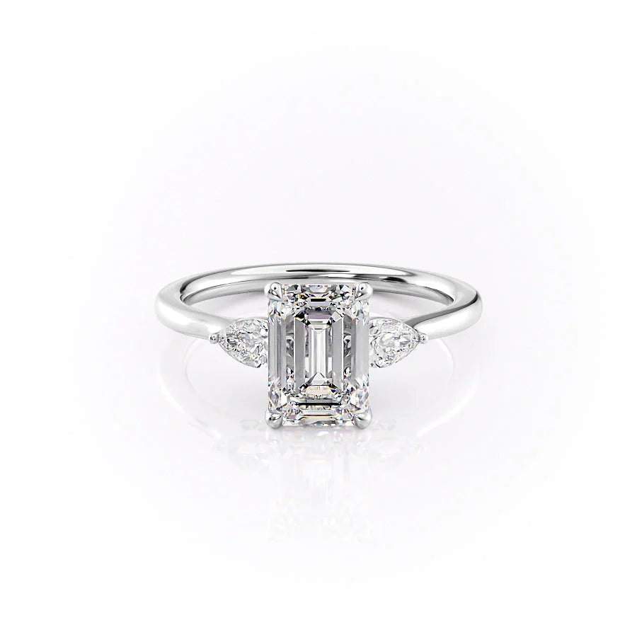 The Megan. A White Gold Three Stone Engagement Ring Set With A 2ct Emerald Lab Grown Diamond. White Background.