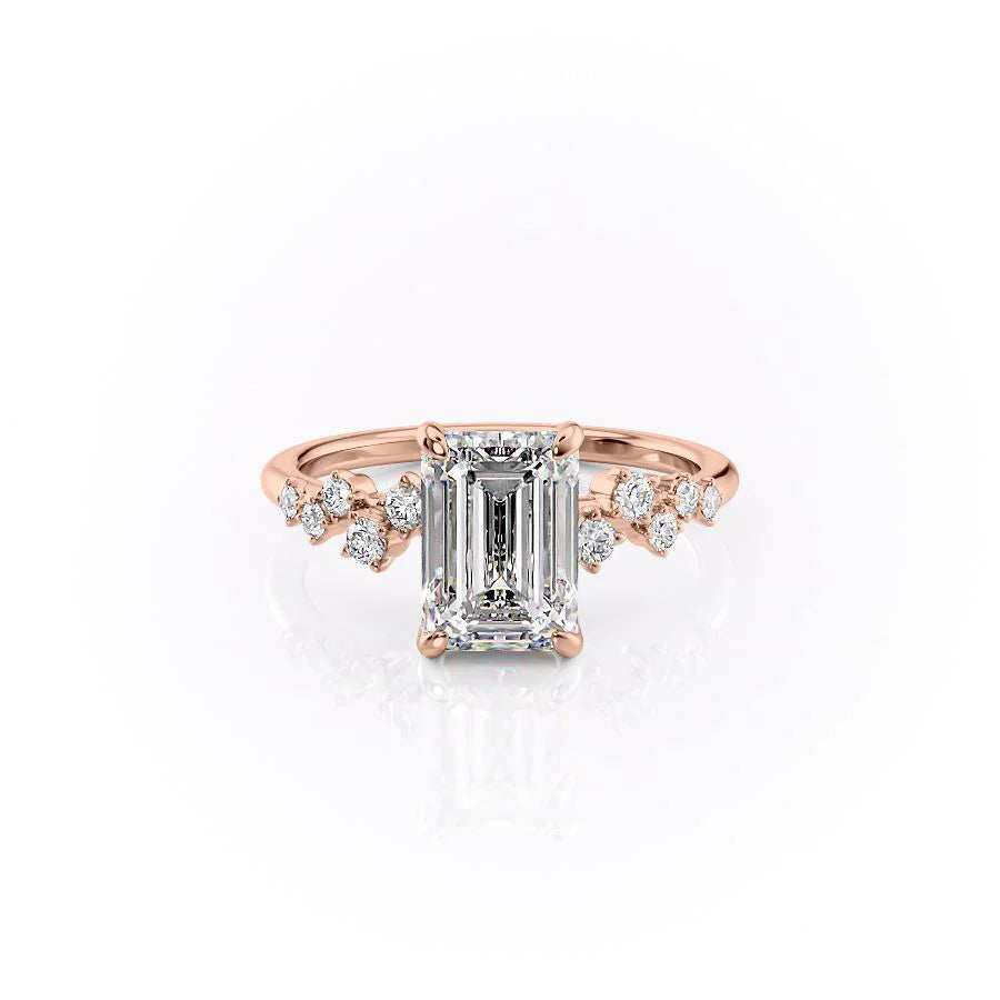 The Mia. A Rose Gold Side Stones, Hidden Halo Engagement Ring Set With A 2ct Emerald Lab Grown Diamond. White Background.